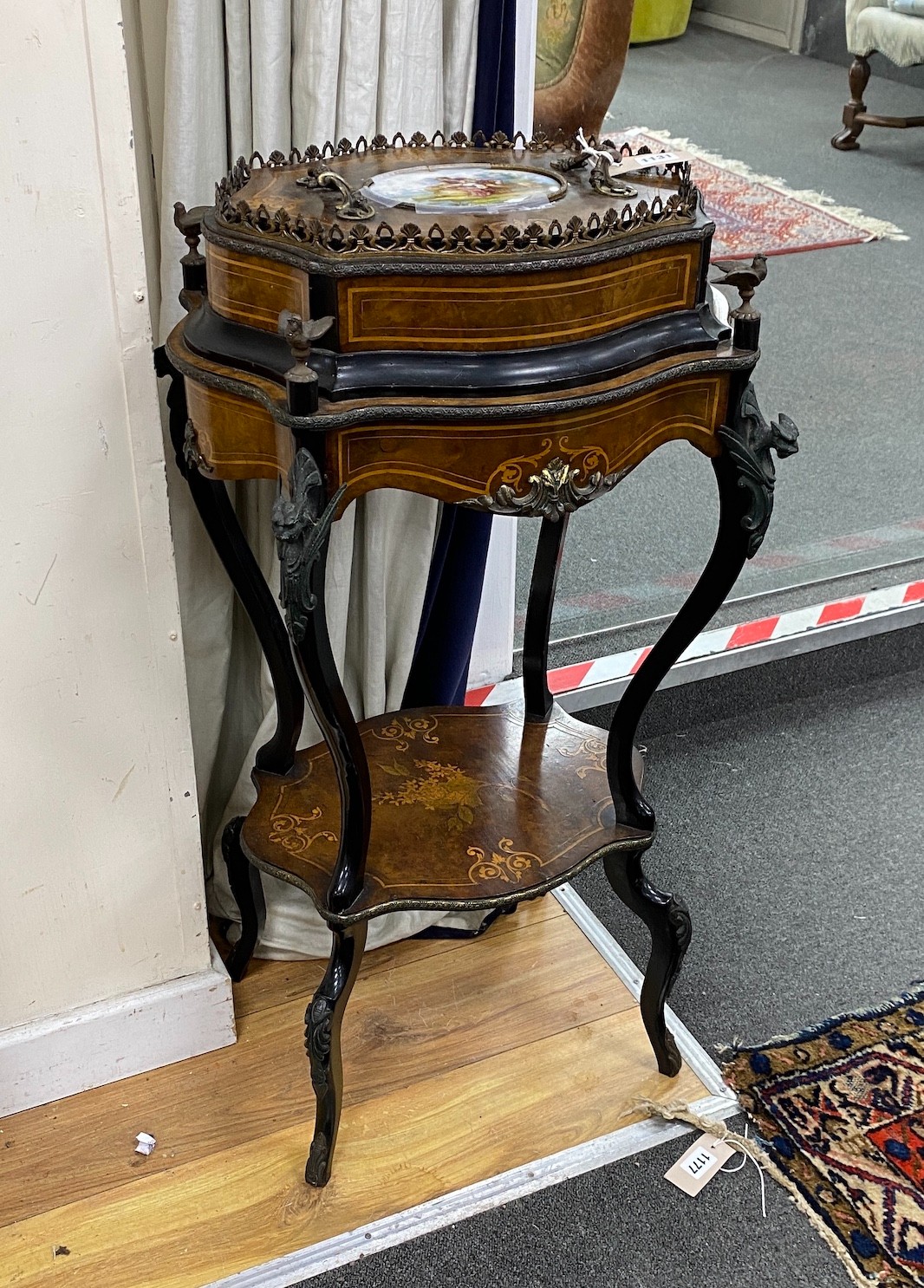 A 19th century French walnut and marquetry porcelain mounted two tier table, width 48cm, depth 35cm, height 88cm